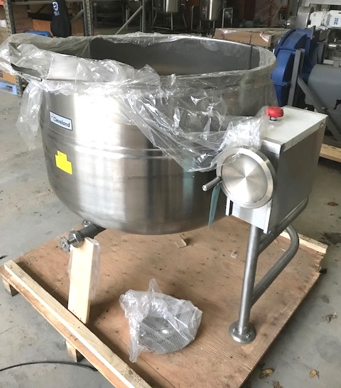 ***SOLD*** UNUSED 125 Gallon Cleveland Kettle model KDL-125-T. Direct Steam Tilting Kettle. Has center bottom outlet and spout for tilt discharge. Jacket rated 35 PSI @ 281 Deg.F.. Stainless Steel Sanitary construction. 